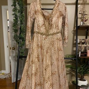 Long sleeve gold ball gown